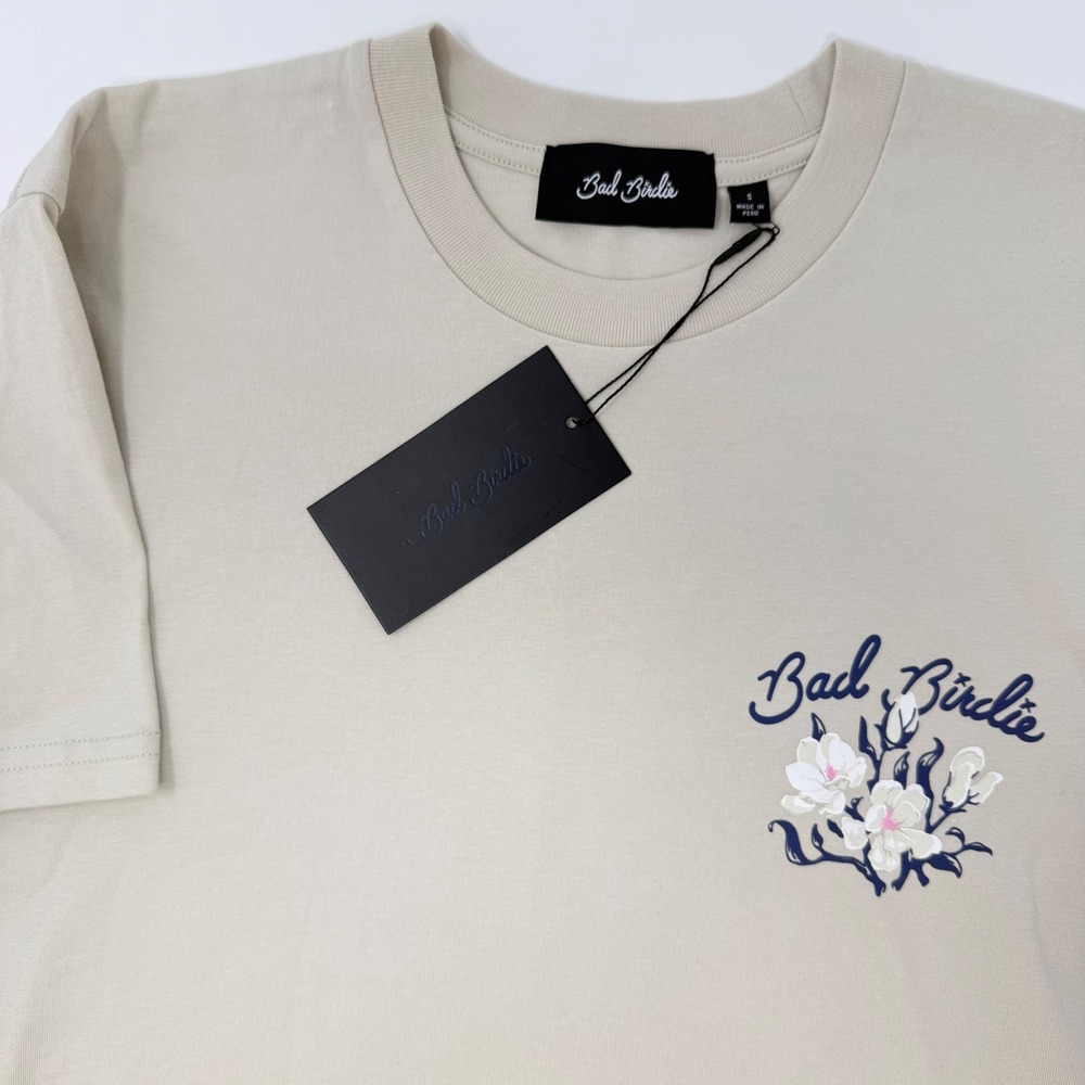 Bad Birdie Beige Short Sleeve Tee with Navy Script and White Floral